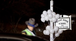 Balloons surround a sign for Sandy Hook in Newtown, Conn. (AP Photo/David Goldman)